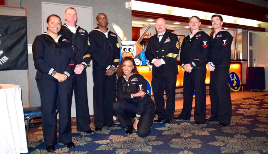 Briana Burton poses with a group of fellow Sailors.