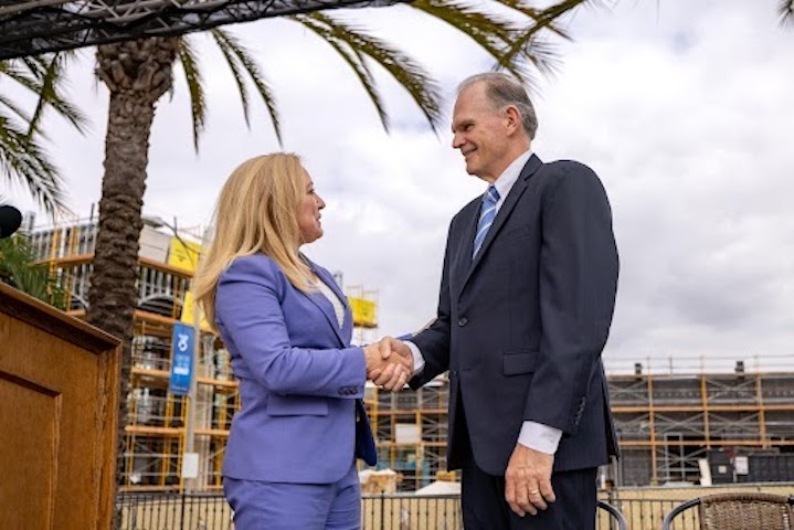 USD President James T. Harris and Palomar Health CEO Diane Hansen shake hands at the USD-Palomar Health partnership announcement event. Photo: Alé Delgado