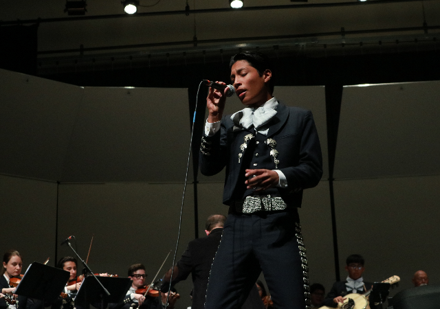 The mariachi ensemble performs on the Shiley Theatre stage.