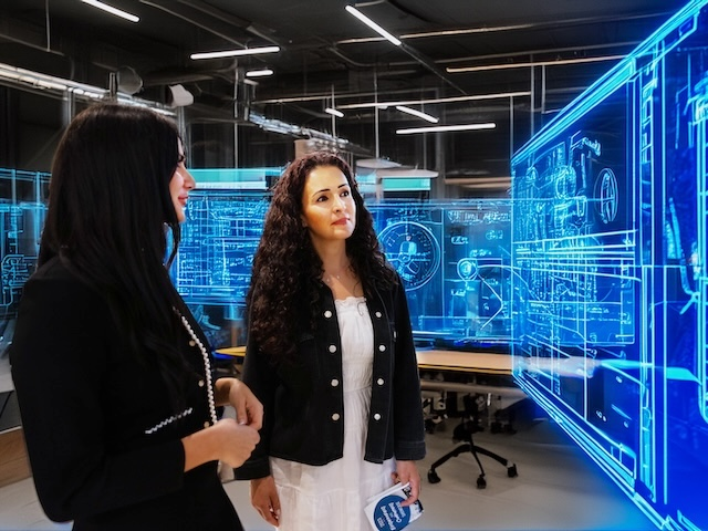 USD engineering student and faculty member looking at AI-generated ideas