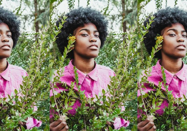 This is a picture of a black woman wearing a pink shirt …