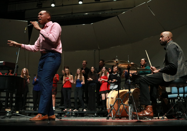 The USD Gospel Choir performs on stage in Shiley Theatre.