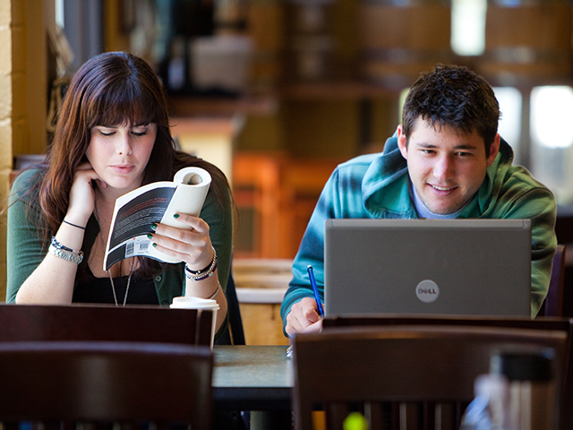 students reading in the library
