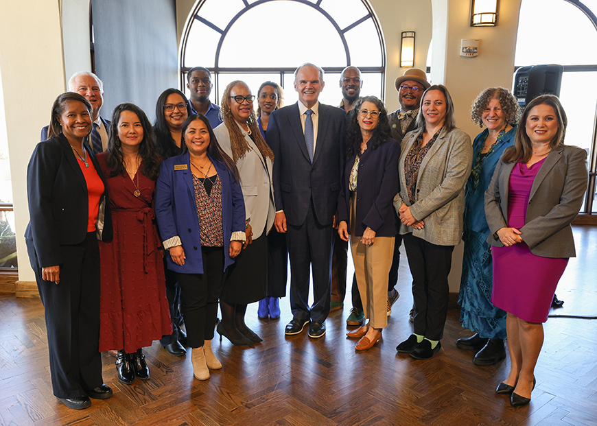 USD President James T. Harris III, DEd; and Vice Provost for Diversity, Equity and Inclusion Regina Dixon-Reeves, PhD, (center) pose with awardees during the Third Annual Diversity and Inclusion Impact Awards in the Hahn University Center on Feb. 15, 2024. (Photo by Matthew Piechalak)