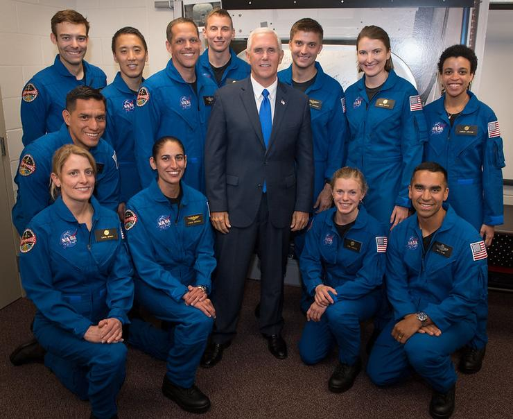 Jonny Kim '12 (second from left; third row) and Matthew Dominik '05 (third from right; third row) join fellow astronaut training program graduates flanking Vice President Mike Pence