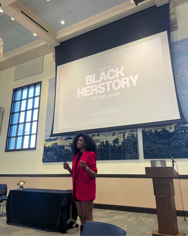 1 faculty member speaking at the Cluster-Theme Symposium IV