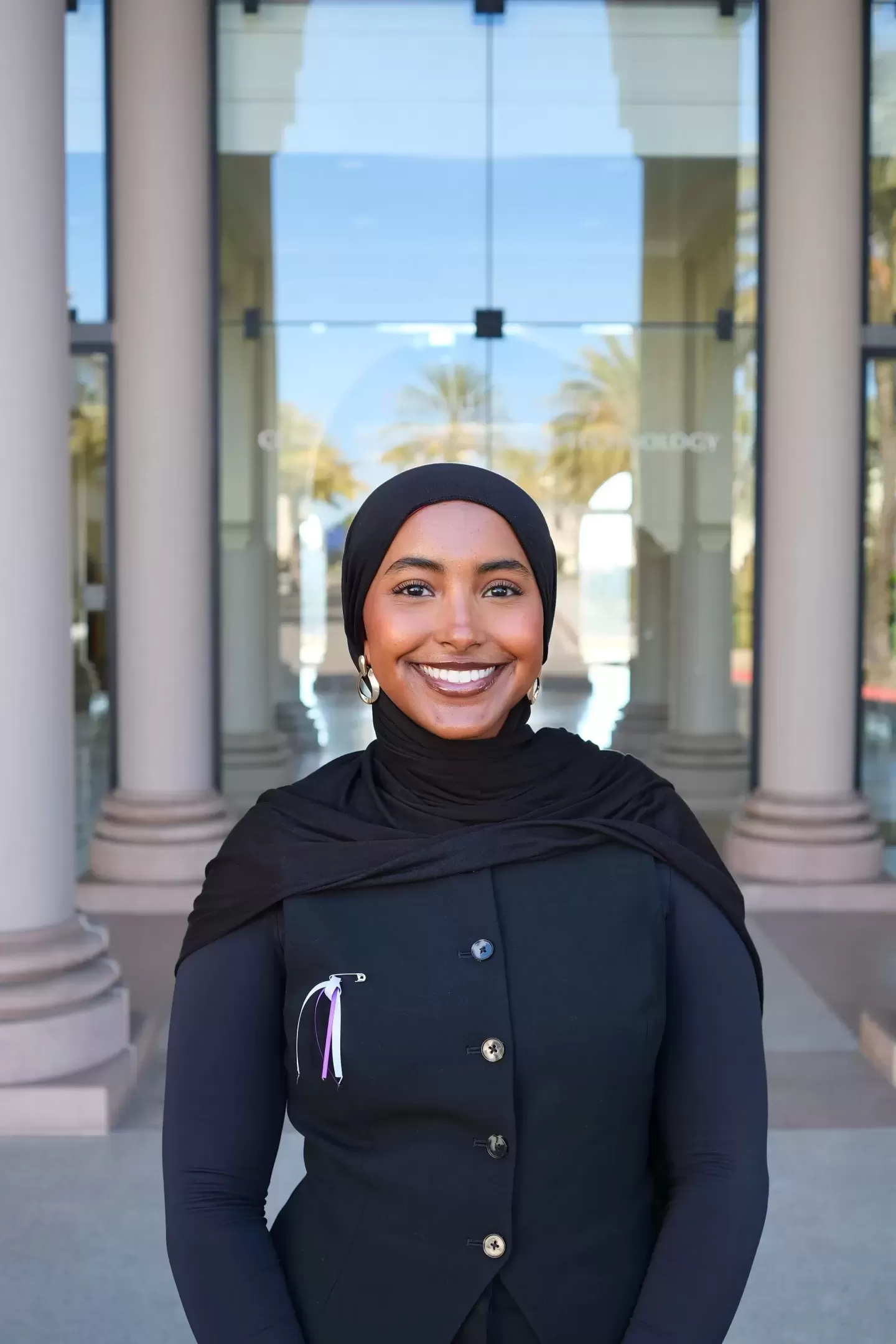 USD student Shukriya Osman smiling outside science building