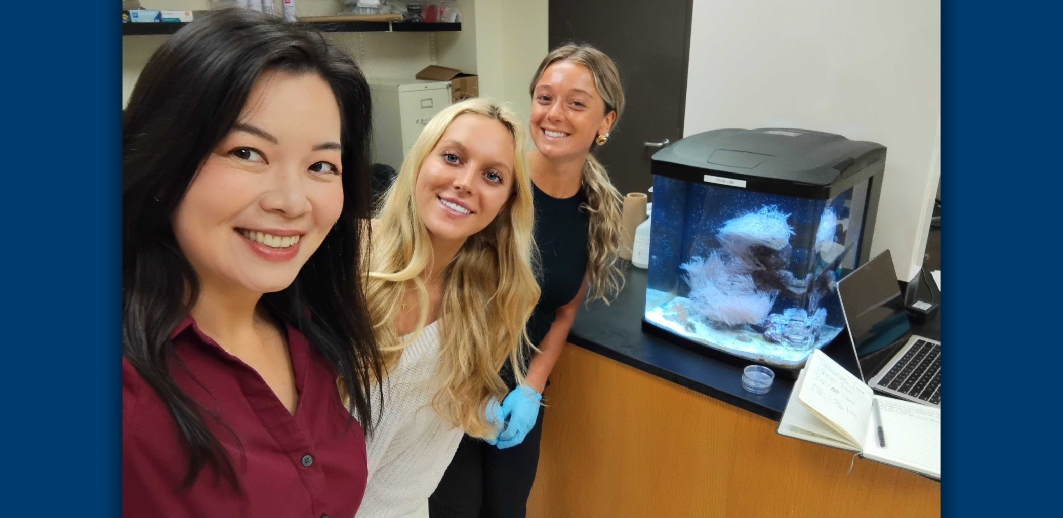 Sarah McCormack (right) smiles for a photo with Cawa Tran, PhD, and Bridget McFall in a lab.