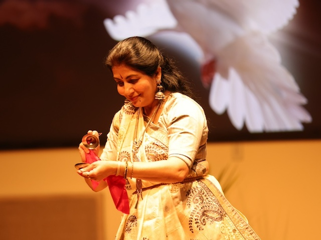 A dancer performs at the 33rd USD All Faith Service
