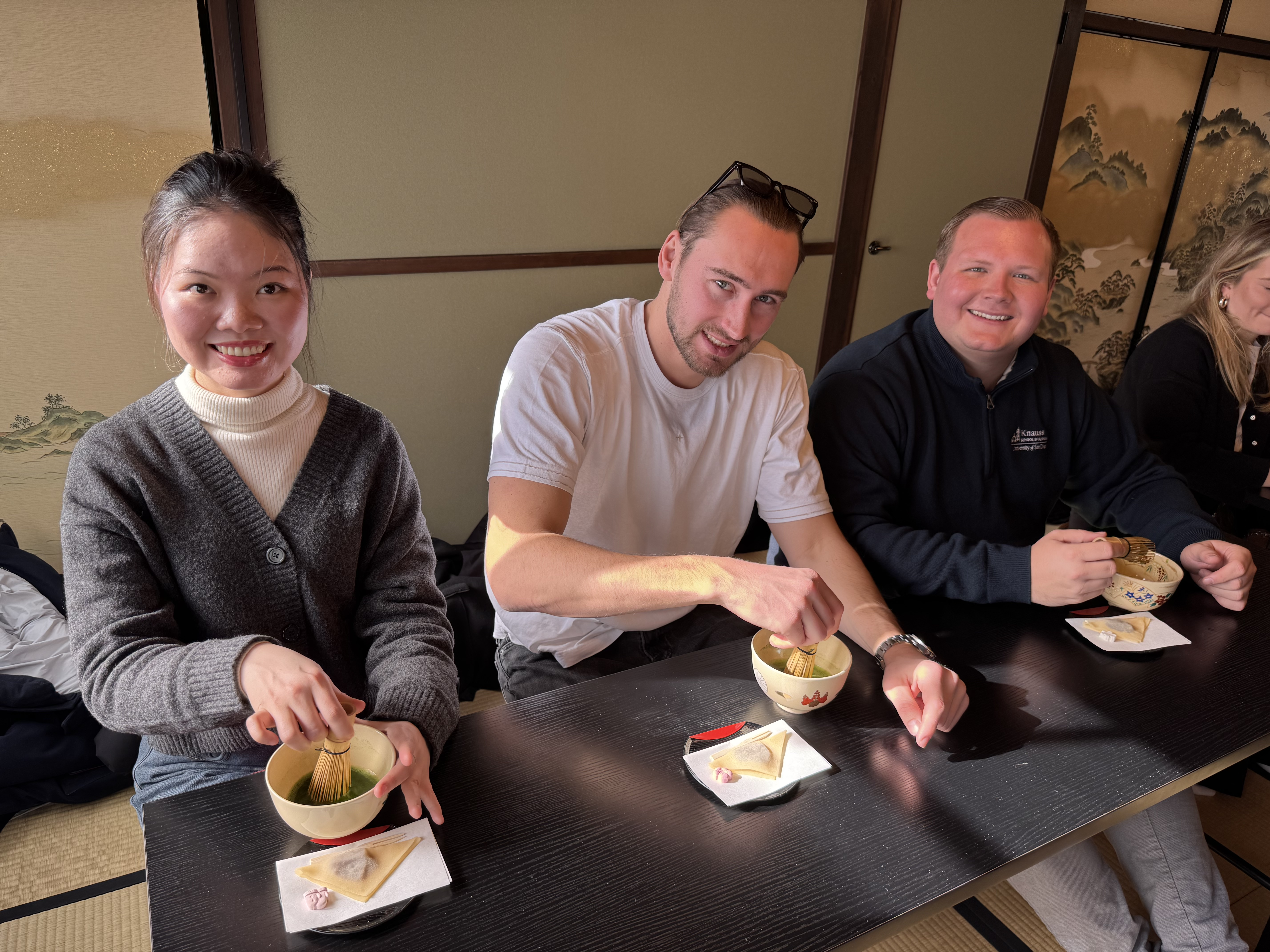Alex and others in his cohort eating in Japan