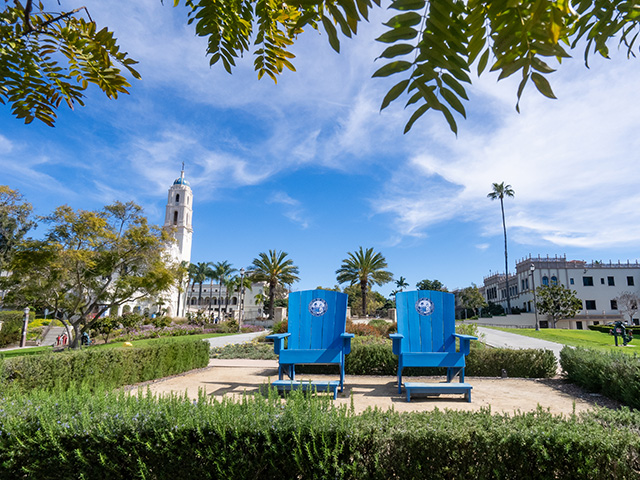 Gemini said
Two blue Adirondack chairs sit in the foreground of the University of San Diego's sunny campus, featuring the iconic blue-domed Immaculata in the background.