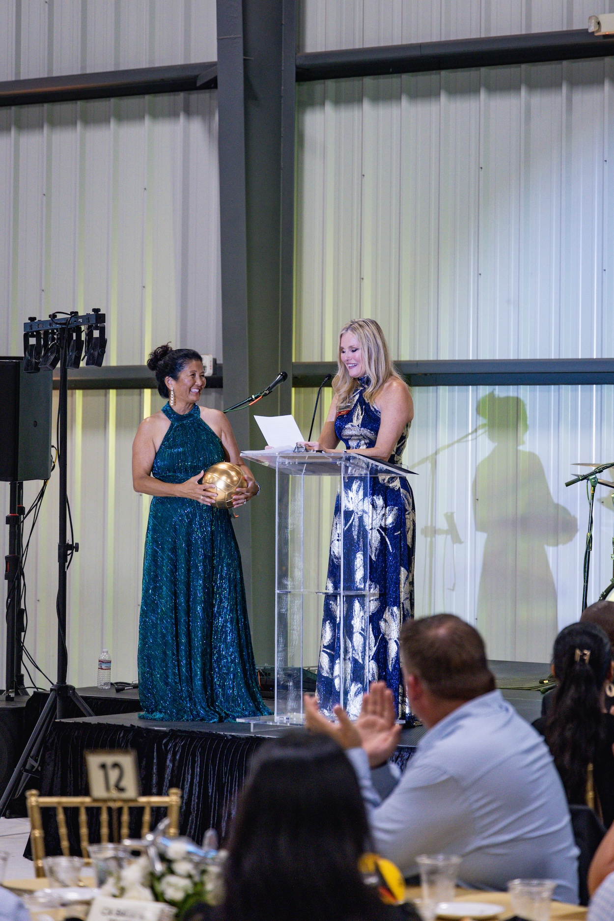 Leslie Oliver accepting an award at a gala