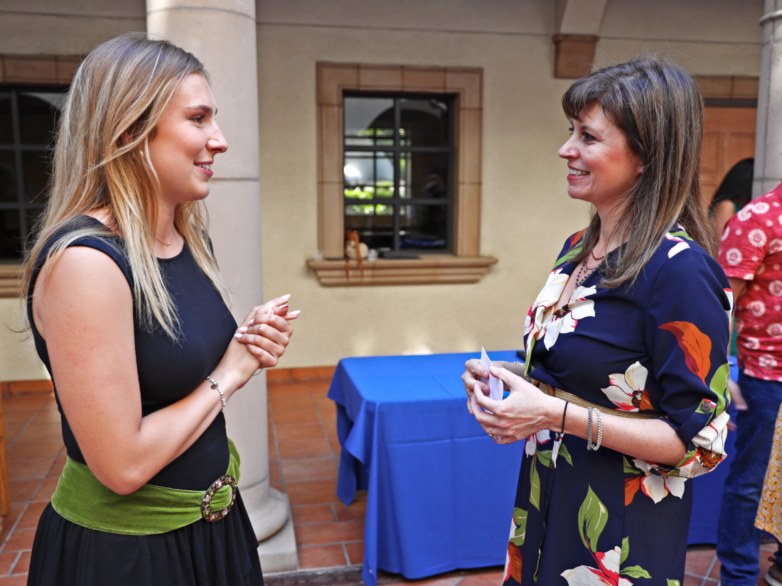 Cassandra Gomez is a USD student standing at the Reception for Pre-Health Graduates in 2025.
