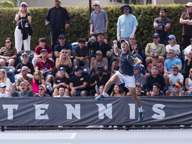 USD men's tennis player celebrates win against UCLA