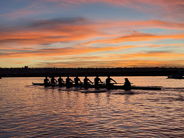 rowers at sunset