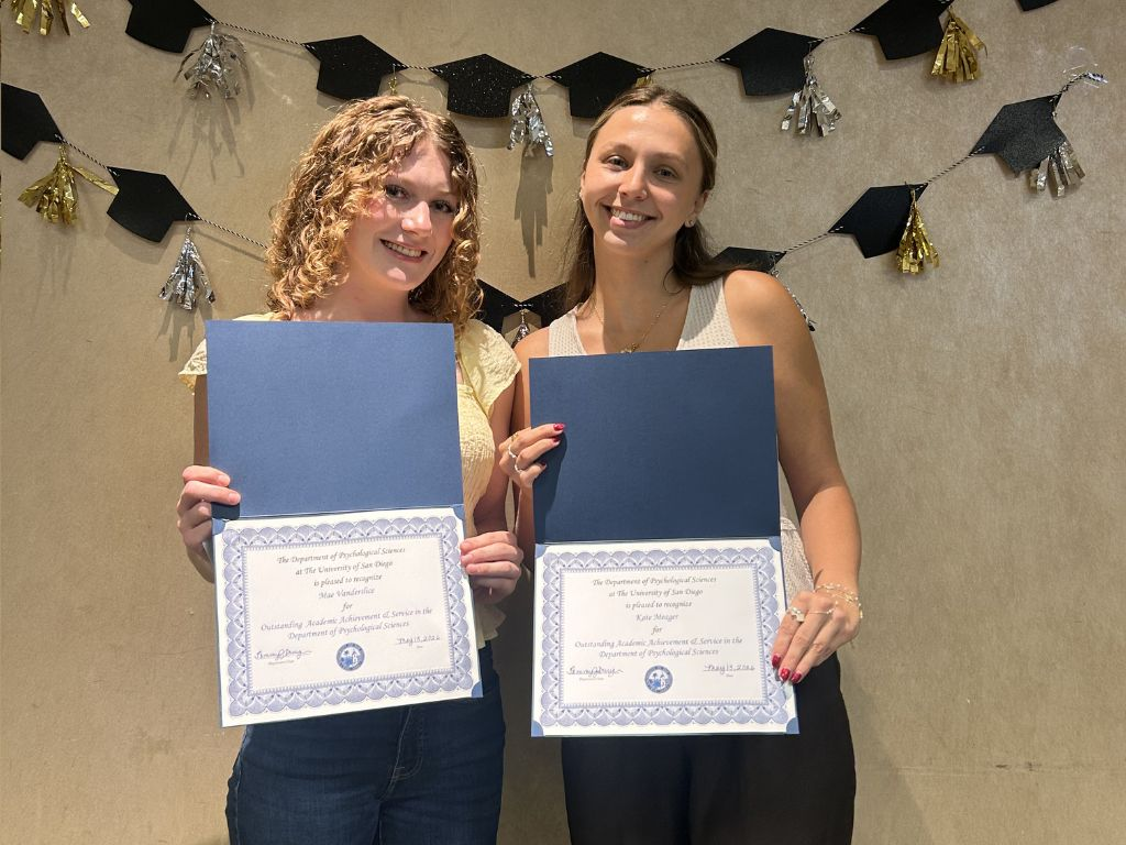 Mae Vanderslice and Kate Meagher holding their awards.