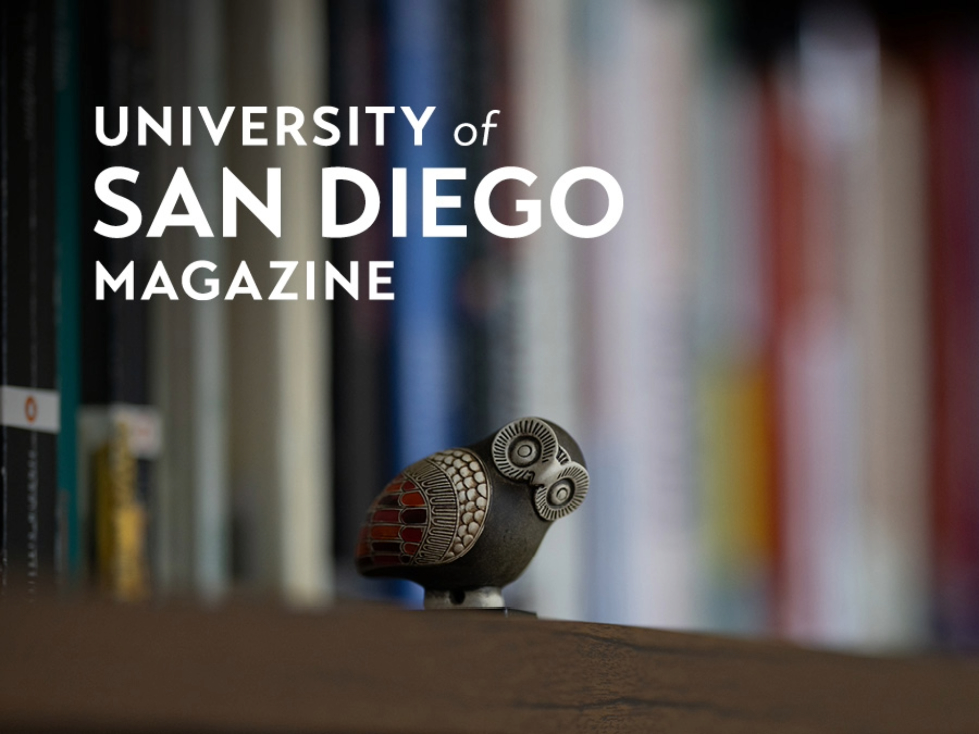 "University of San Diego Magazine" -- Owl figurine on a bookcase