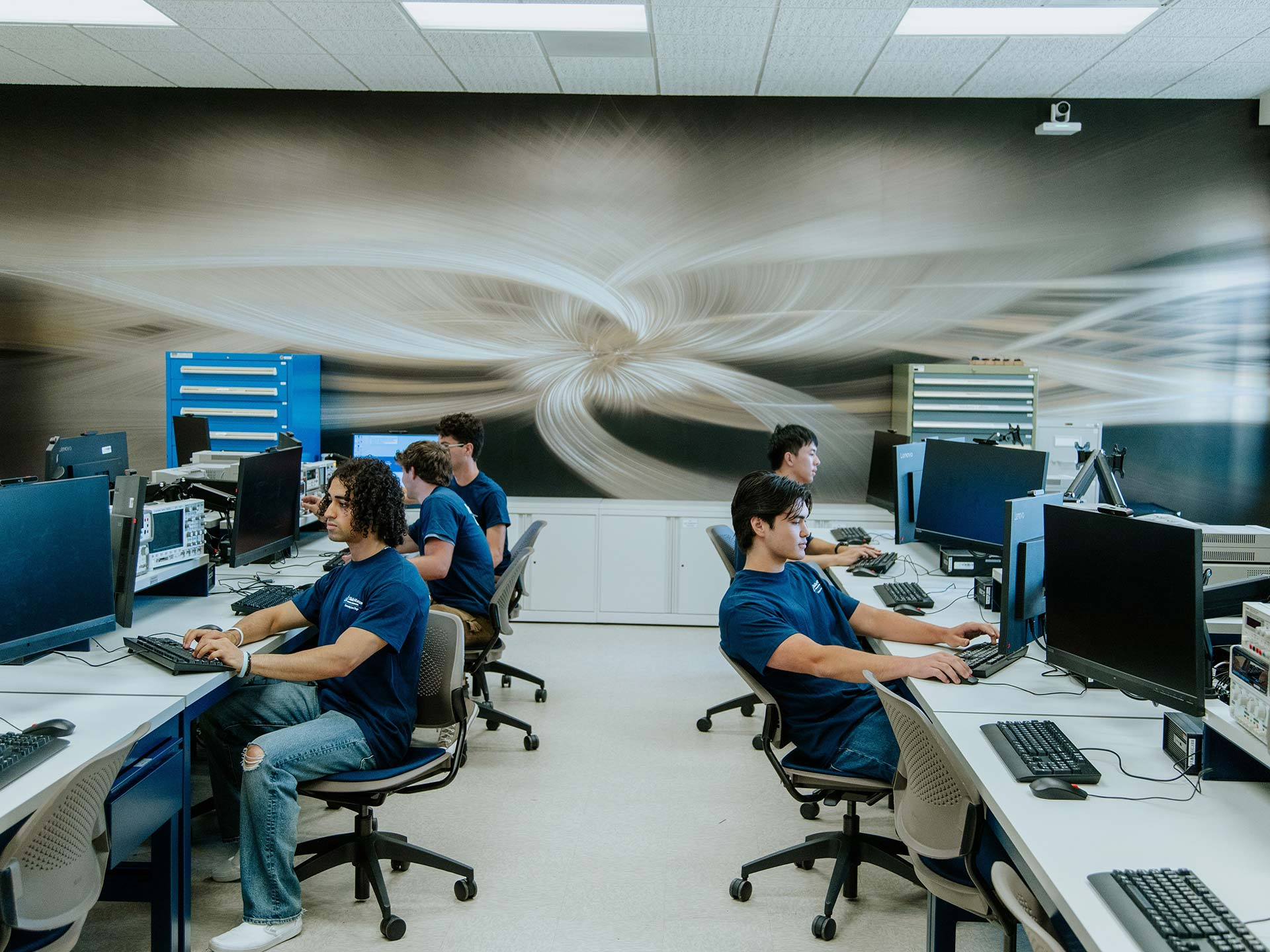 students in a class with computers on the usd campus