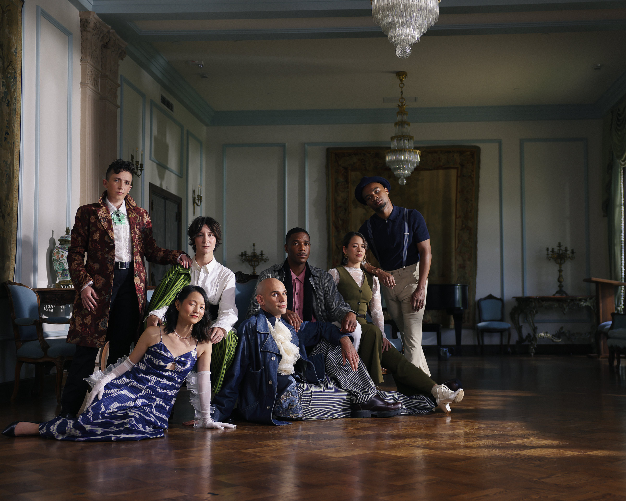 Photo of MFA Class of 2026 in the French Parlor, with dramatic lighting.