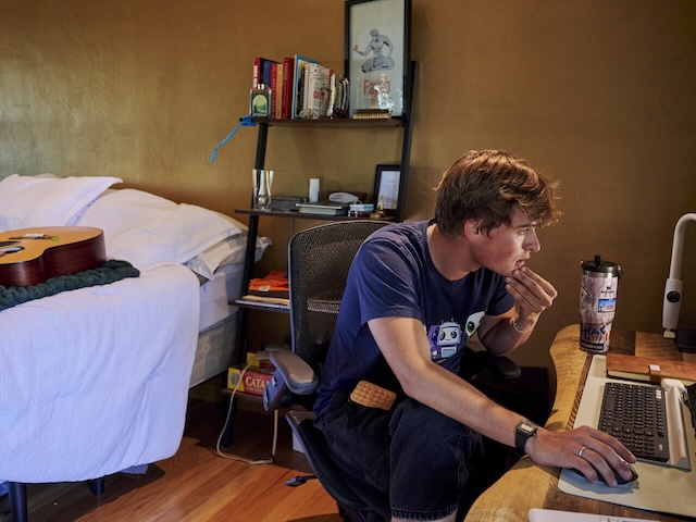 Zach Kinzler working on his computer