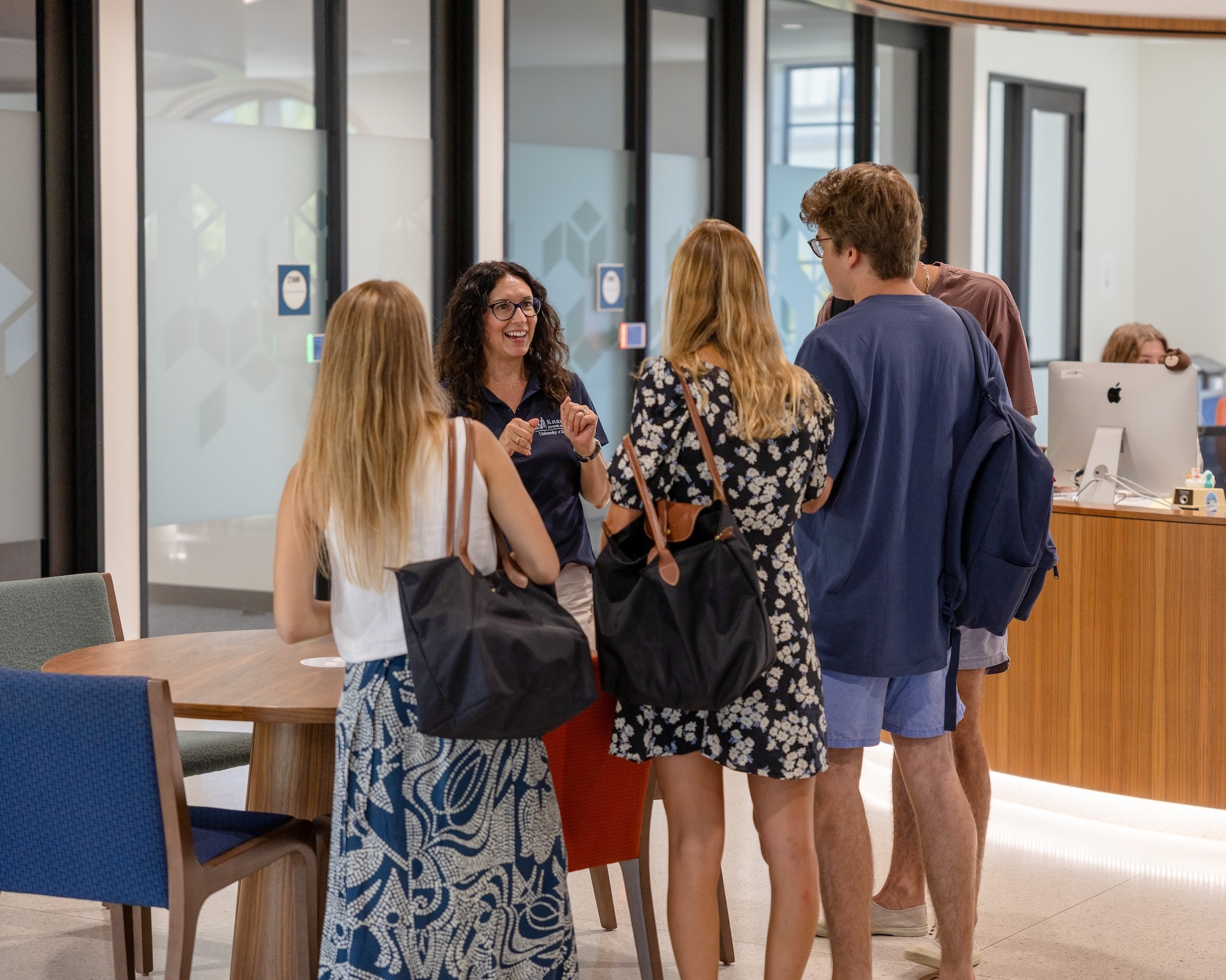 an advisor speaking with students on the first day of school 