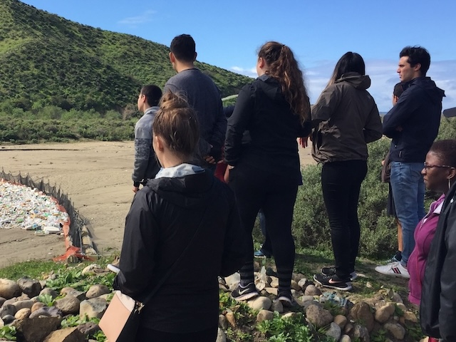 ExSJ visiting a site with trapped waste