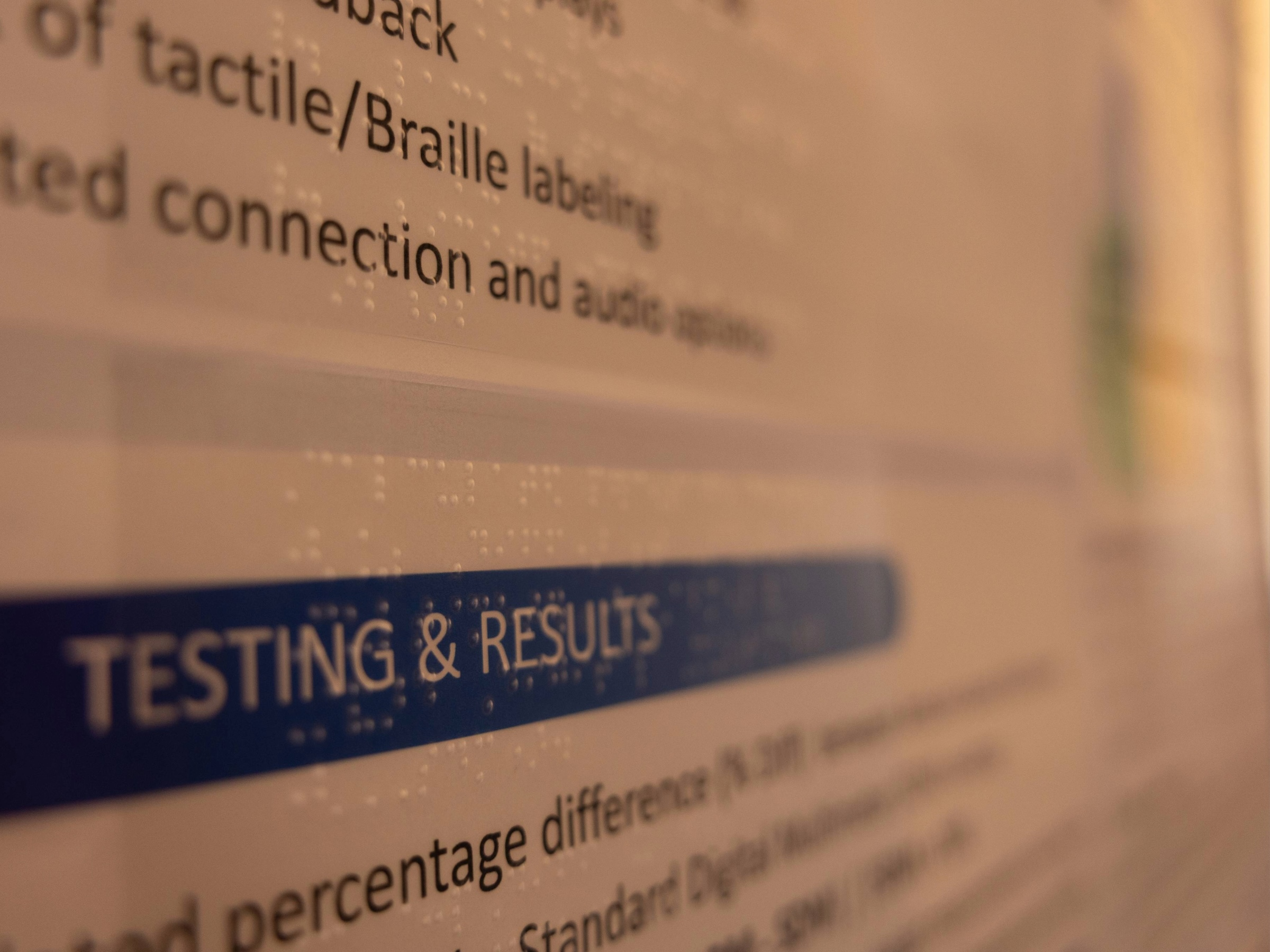 Research poster covered in braille for accessibility