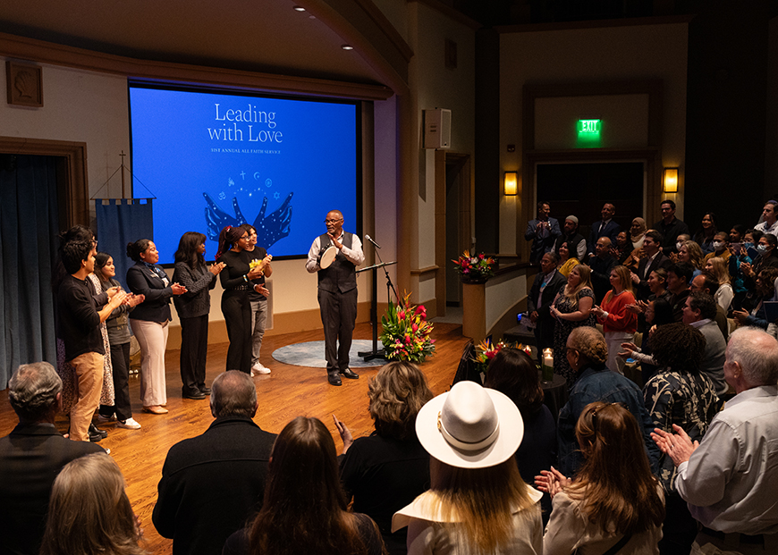 The USD Gospel Choir leads the audience in a closing song during the 31st Annual All Faith Service inside the Joan B. Kroc Institute for Peace and Justice Theatre on Feb. 8, 2024. (Photo by Matthew Piechalak)