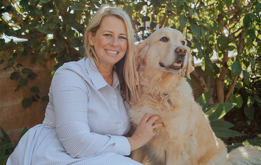Brittany Catton Kirk, with service dog, Magnus, is graduating this month from the Kroc School's MASI program and is a USD finalist for the Fowler Global Social Innovation Challenge with Sunlight U.