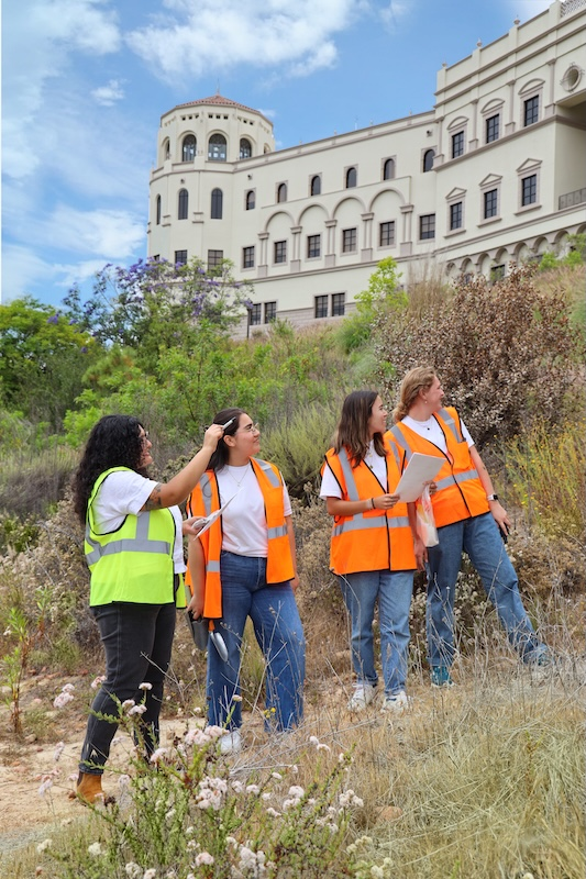 Claudia Avila and USD students on campus doing soil fieldwork