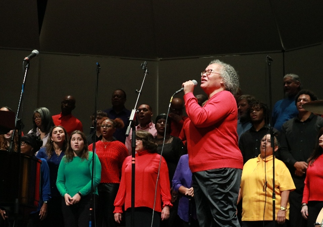 USD Gospel Choir and soloist perform on the Shiley Theatre stage.