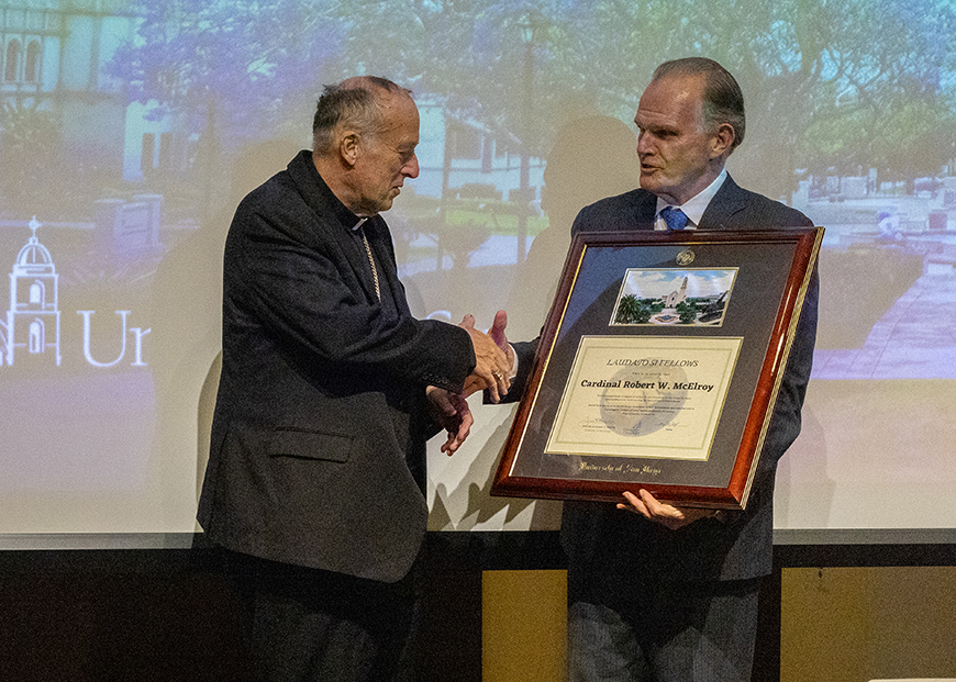 University of San Diego President James T. Harris, DEd, presents Cardinal Robert Walter McElroy with a Laudato si' Fellows Award following McElroy’s keynote address at USD’s Lighting the Way Forward Conference inside the University Forums on Thursday, Jan. 11, 2024.  (Photo by Matthew Piechalak)