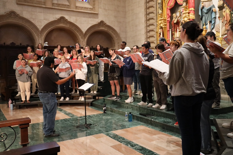 USD Choir students practice in preparation for this weekend's Lessons and Carols event in Founders Chapel.