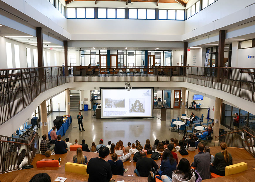 Students and faculty listen to a presenter during the 34th Creative Collaborations inside the Learning Commons on Tuesday, April 16, 2024. (Photo by Matthew Piechalak)