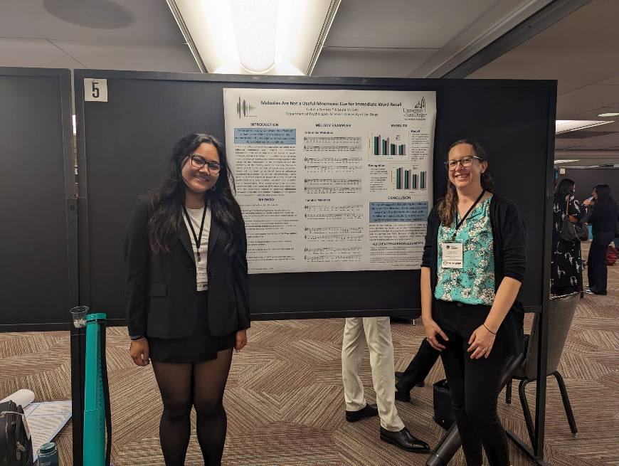 Isabella Ramirez and Laura Getz, PhD, with Ramirez's poster 