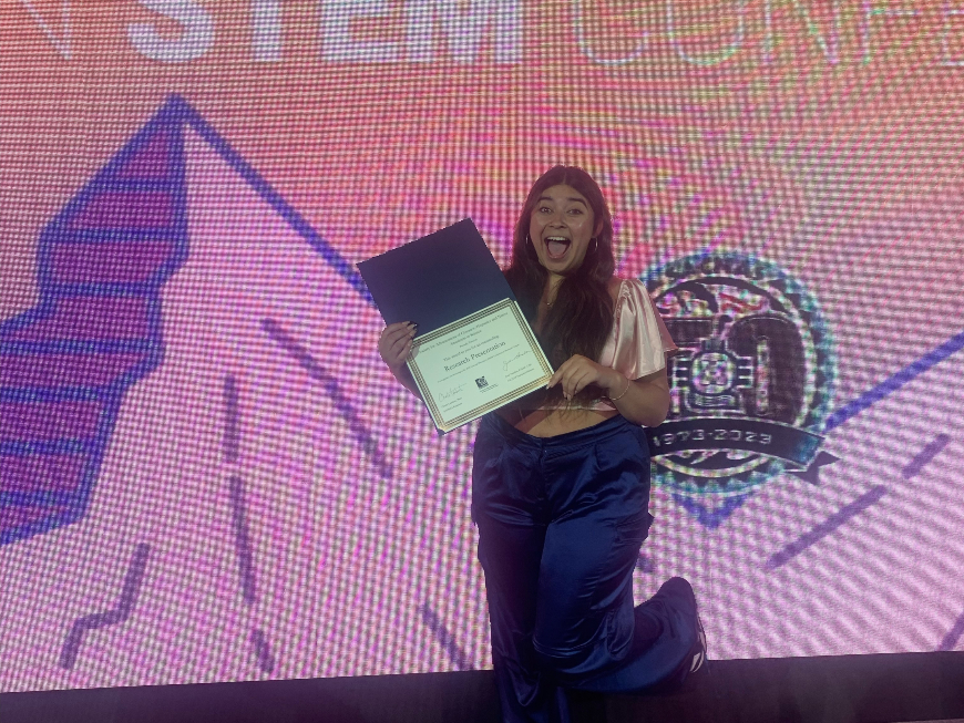 Menera with her award at SACNAS