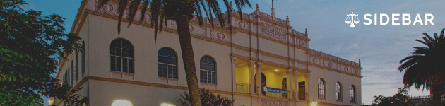 Features the top half of Warren Hall with the Sidebar logo imposed in the top right.